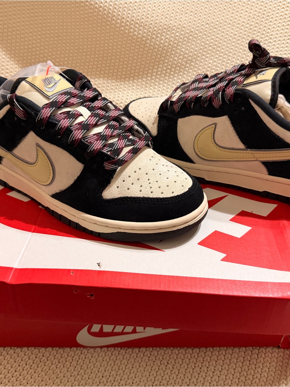 Nike Low-Top Sneakers in Black and Cream with Yellow Swoosh